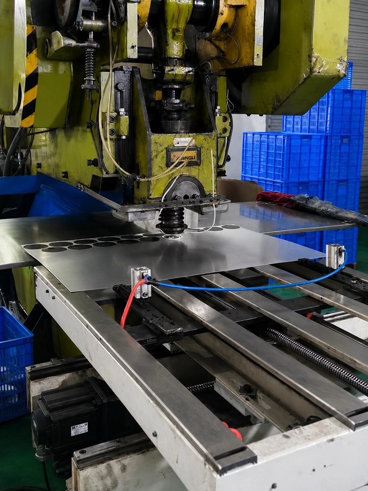 Metal stamping machine preparing parts for production